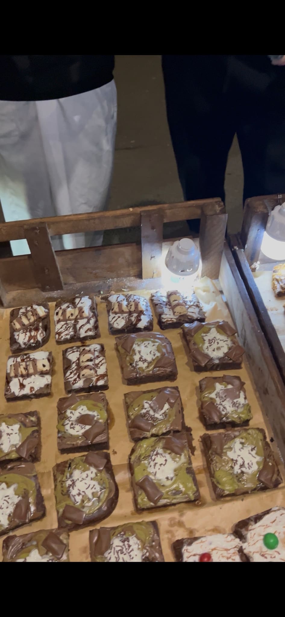 A Sakoon stall table loaded with handmade brownies at a community event